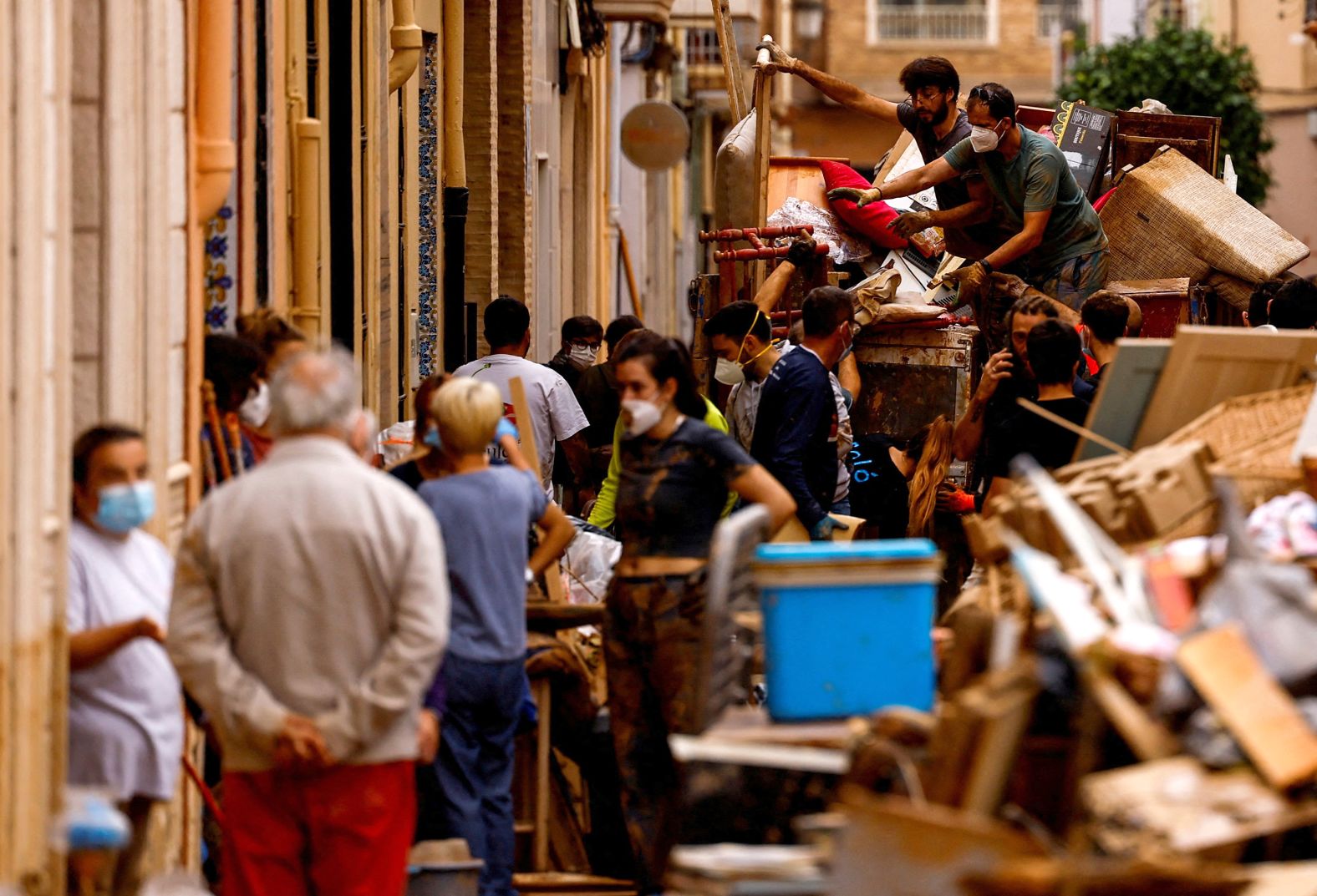 People load belongings on a truck in Sedavi on Sunday.