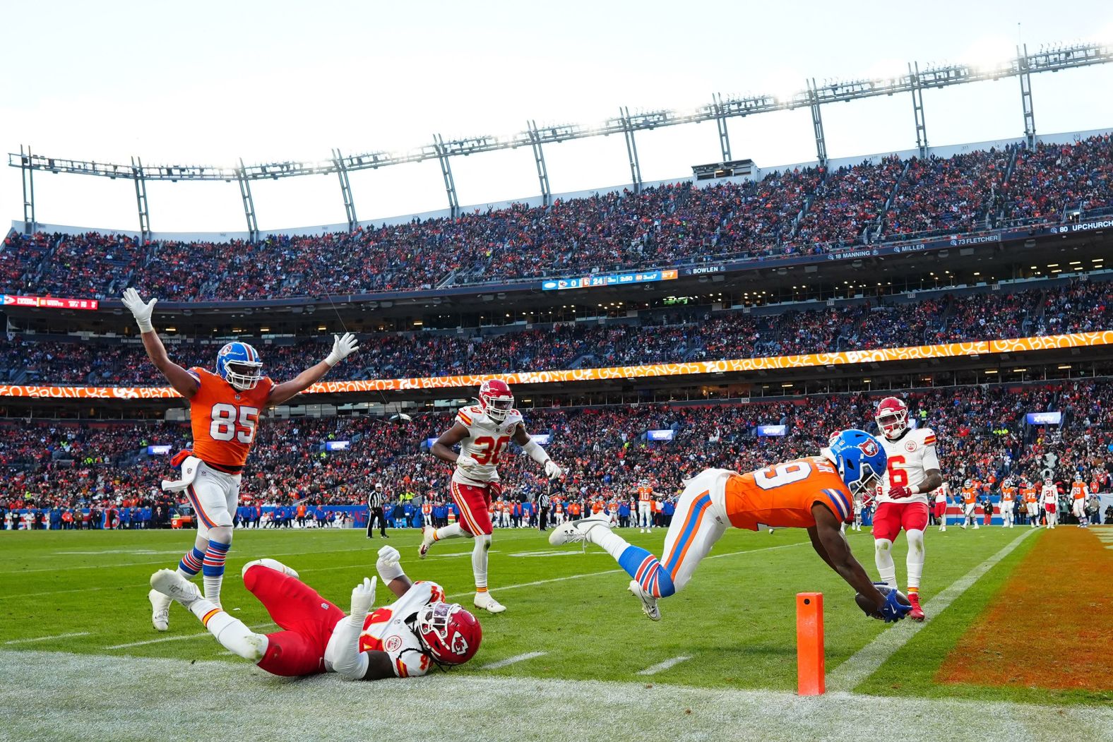 Denver Broncos wide receiver Marvin Mims Jr. scores a touchdown during the Broncos’ 38-0 home victory over the Kansas City Chiefs on Sunday, January 5. The victory clinched a playoff berth for the Broncos. The Chiefs rested many of their starters because they had already clinched the AFC’s No. 1 seed. <a href="index.php?page=&url=https%3A%2F%2Fwww.cnn.com%2F2024%2F09%2F09%2Fsport%2Fgallery%2Fnfl-2024-season%2Findex.html">See the best photos from this NFL season</a>.