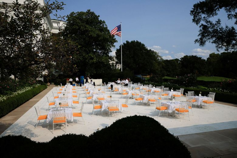 Waiters work on preparations for a dinner hosted by President Donald Trump on the renovated 