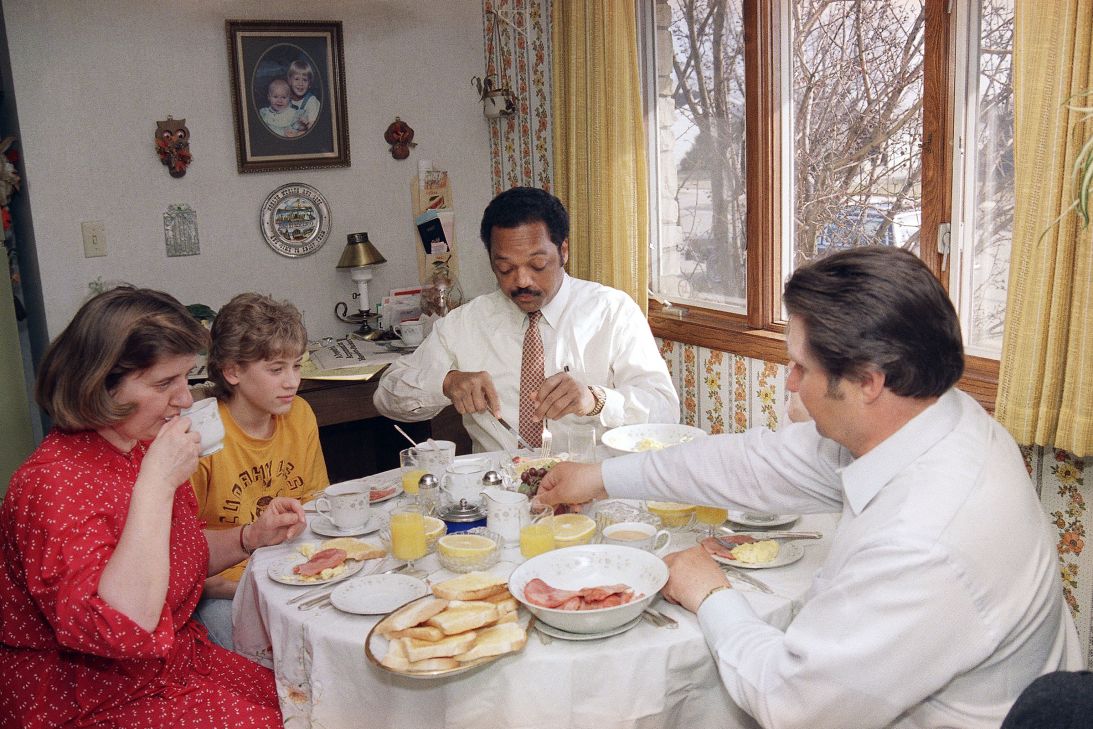 Jesse Jackson joins the Becker family for breakfast after spending the night in their home in Cudahy, Wisconsin.