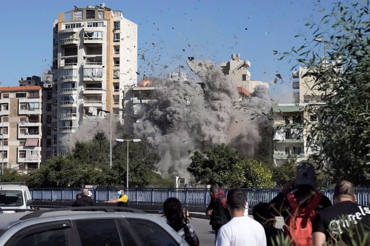 People watch as the missile strikes the building.