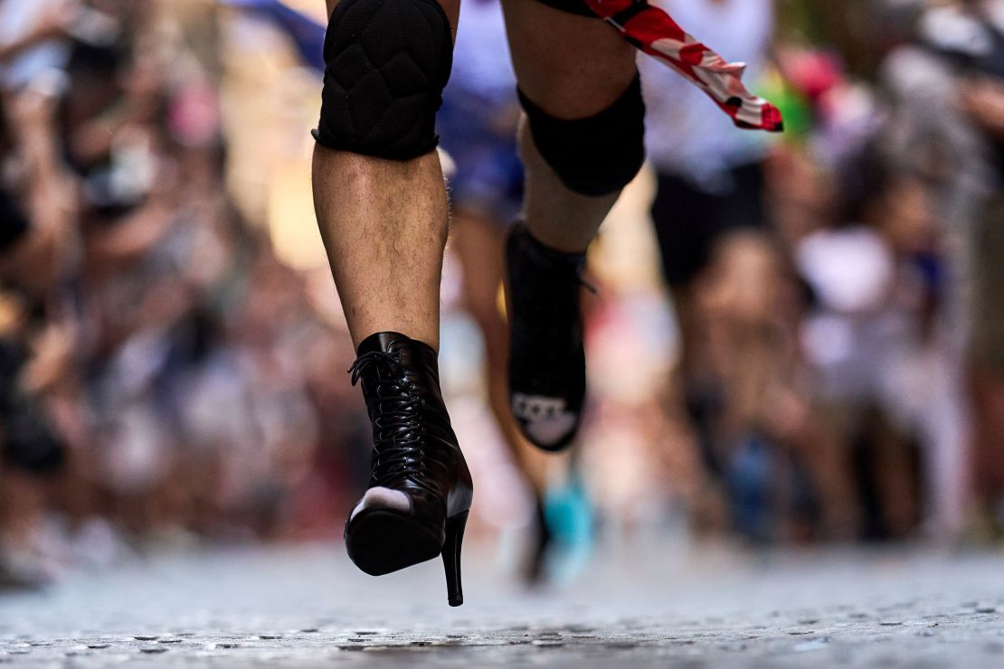 A participant runs in a pair of high heeled boots.