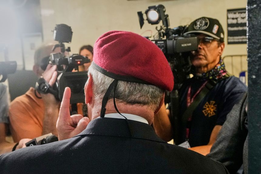 Curtis Sliwa, wearing his signature red beret, is interviewed in a subway station on August 18.