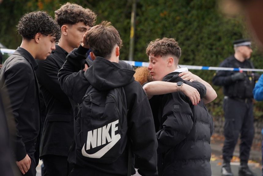 People react close to the scene of a stabbing incident at Heaton Park Hebrew Congregation synagogue in Manchester, England, on Thursday.