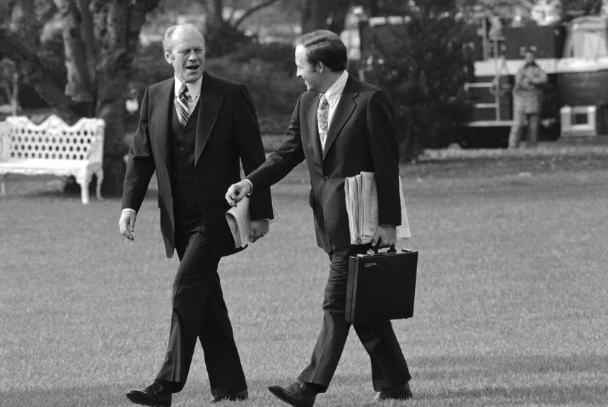 White House Chief of Staff Cheney chats with President Gerald Ford outside the White House as they walk to a helicopter in Washington, DC, on November 7, 1975.