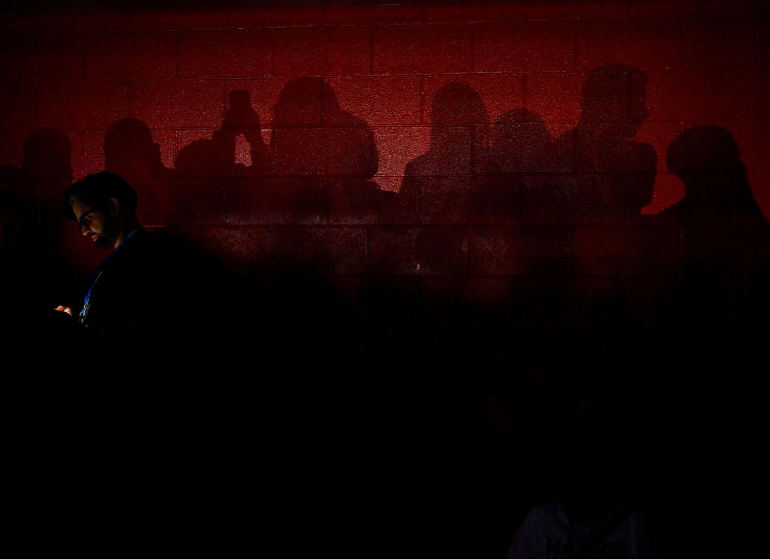 Convention attendees cast shadows on the upper level of the United Center on Thursday.