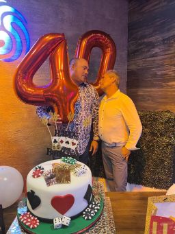 This photo from Brian Butler's 40th birthday party shows Butler, left, and Carlos De Oliveira, right.