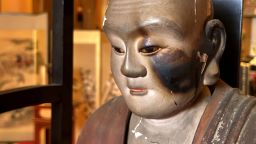 A statue of a revered Buddhist monk shows damage on its left side from the Aug. 14-15 firebombing of Kumagaya, Japan.

Brad Lendon/CNN