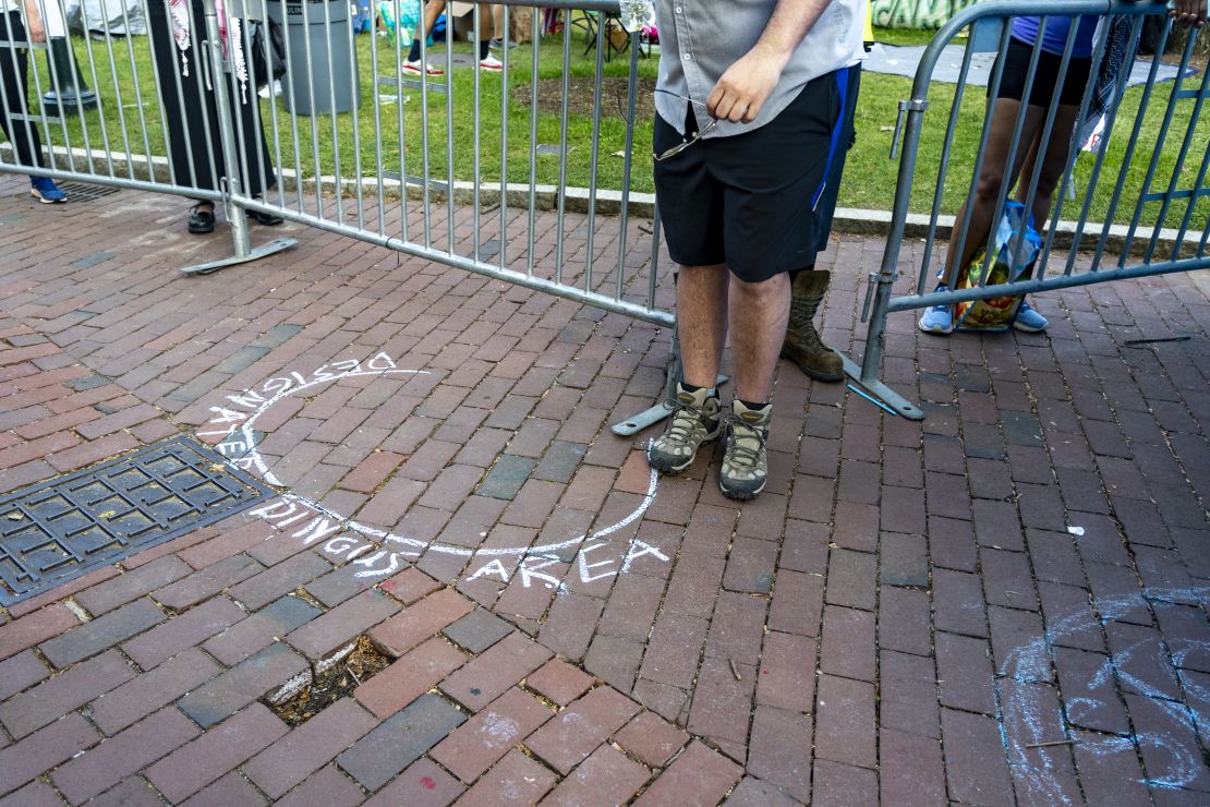 A circle drawn by a protester around the counter protester, labeled as the “Designated Dingus Area.”