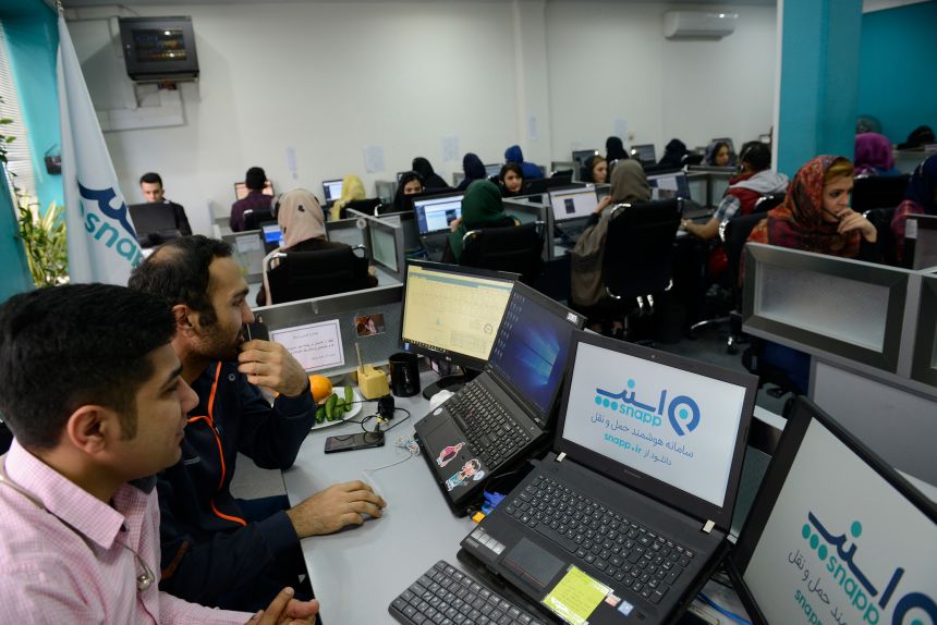 Employees are seen in the operations room of the Snapp online taxi service on April 8, 2018 in Tehran, Iran. Snapp launched in February 2014.
