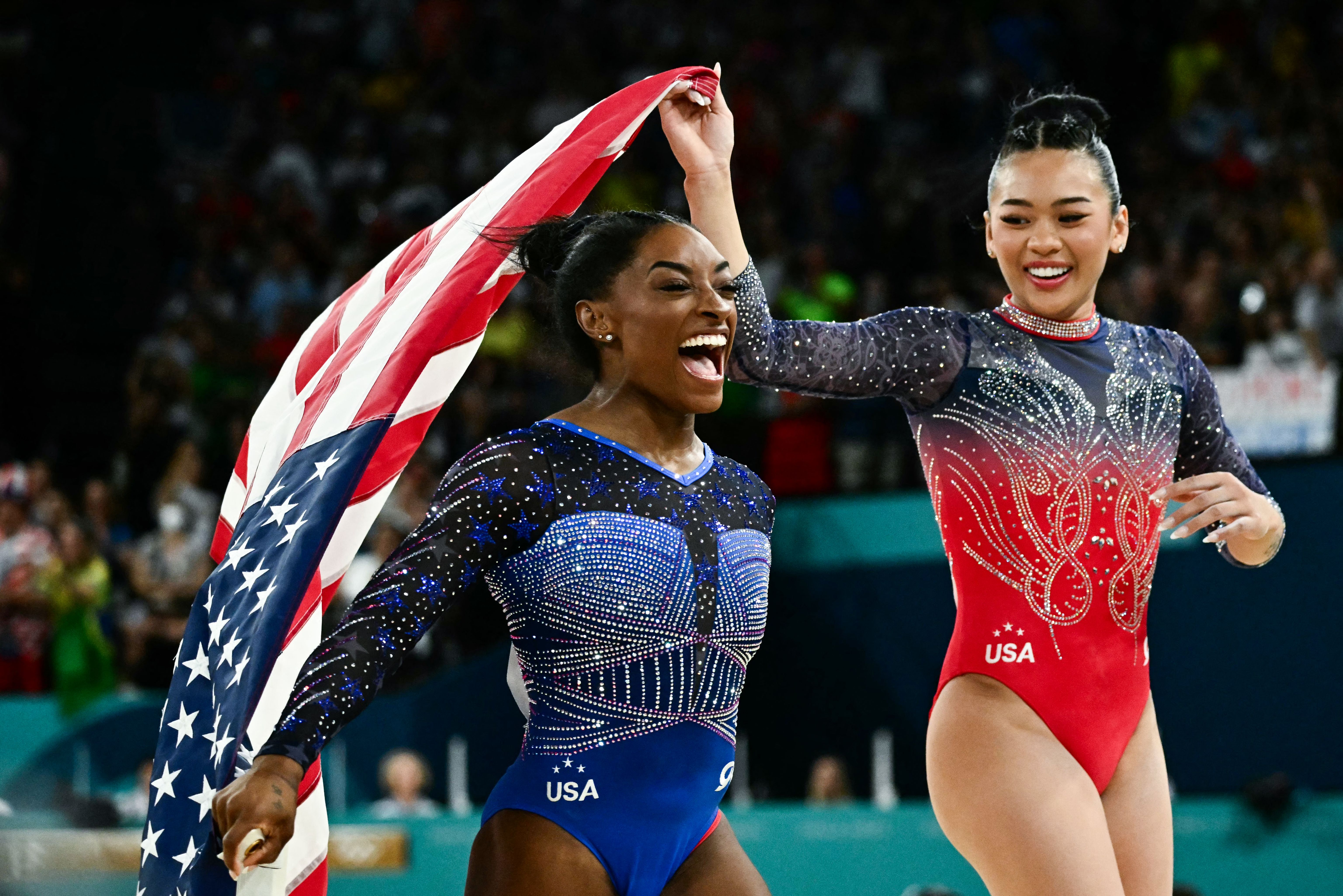 Biles and Lee celebrate after the competition ended. Earlier this week, they won gold in the team event.