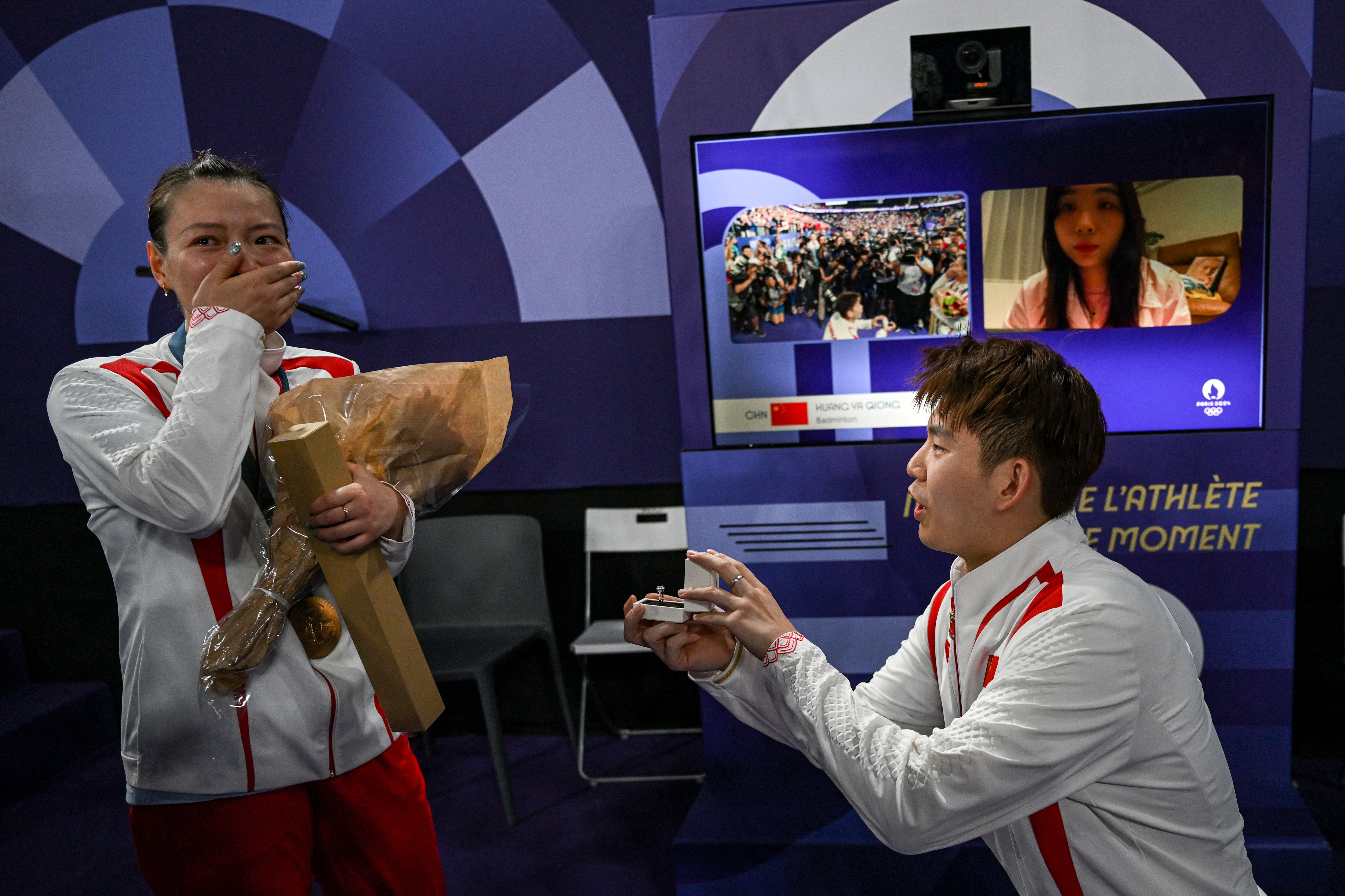 Chinese badminton player Liu Yuchen <a href="https://www.cnn.com/sport/live-news/paris-olympics-news-2024-08-02-24#h_8d26bdbde4e45795009af410aee226a6">proposes to his girlfriend</a>, Huang Yaqiong, after she and Zheng Siwei won gold in mixed doubles on August 2.