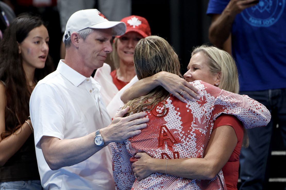 NANTERRE, FRANCE - AUGUST 03: Gold Medalist Summer McIntosh of Team Canada celebrates with family following the Swimming medal ceremony after the Women's 200m Individual Medley Final on day eight of the Olympic Games Paris 2024 at Paris La Defense Arena on August 03, 2024 in Nanterre, France. (Photo by Quinn Rooney/Getty Images)