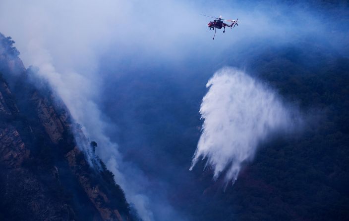 A helicopter drops water on the Franklin Fire on Wednesday.