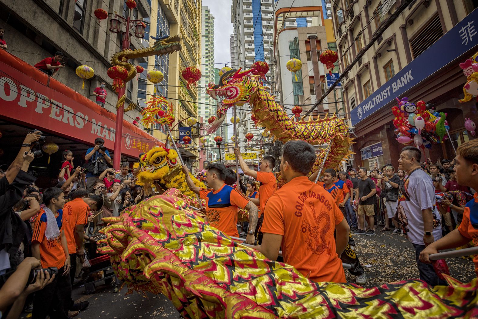 Dragon and lion dancers perform during Lunar New Year celebrations in the Binondo district, considered the world's oldest Chinatown, Manila, Philippines, on Wednesday, January 29.