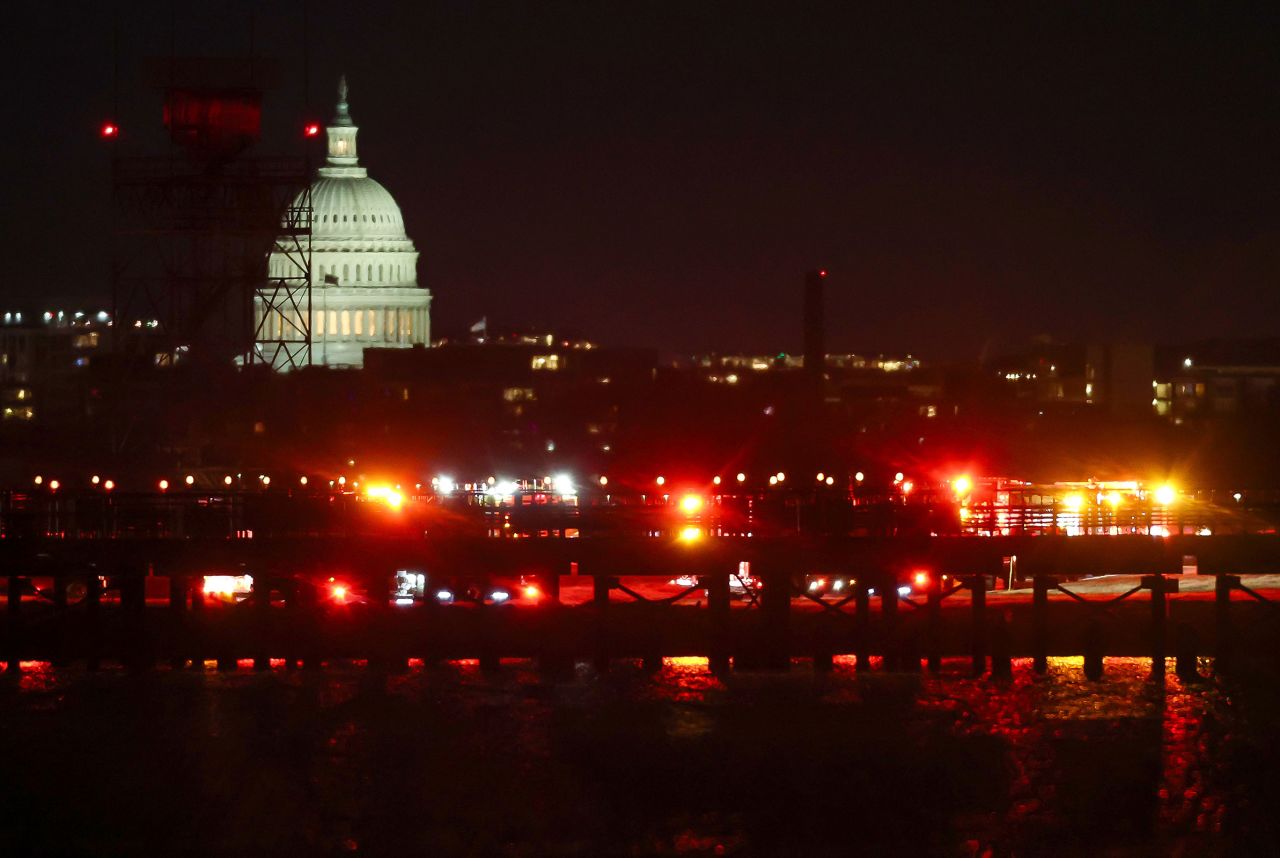 The US Capitol is visible as emergency response units assemble near the site of the crash.