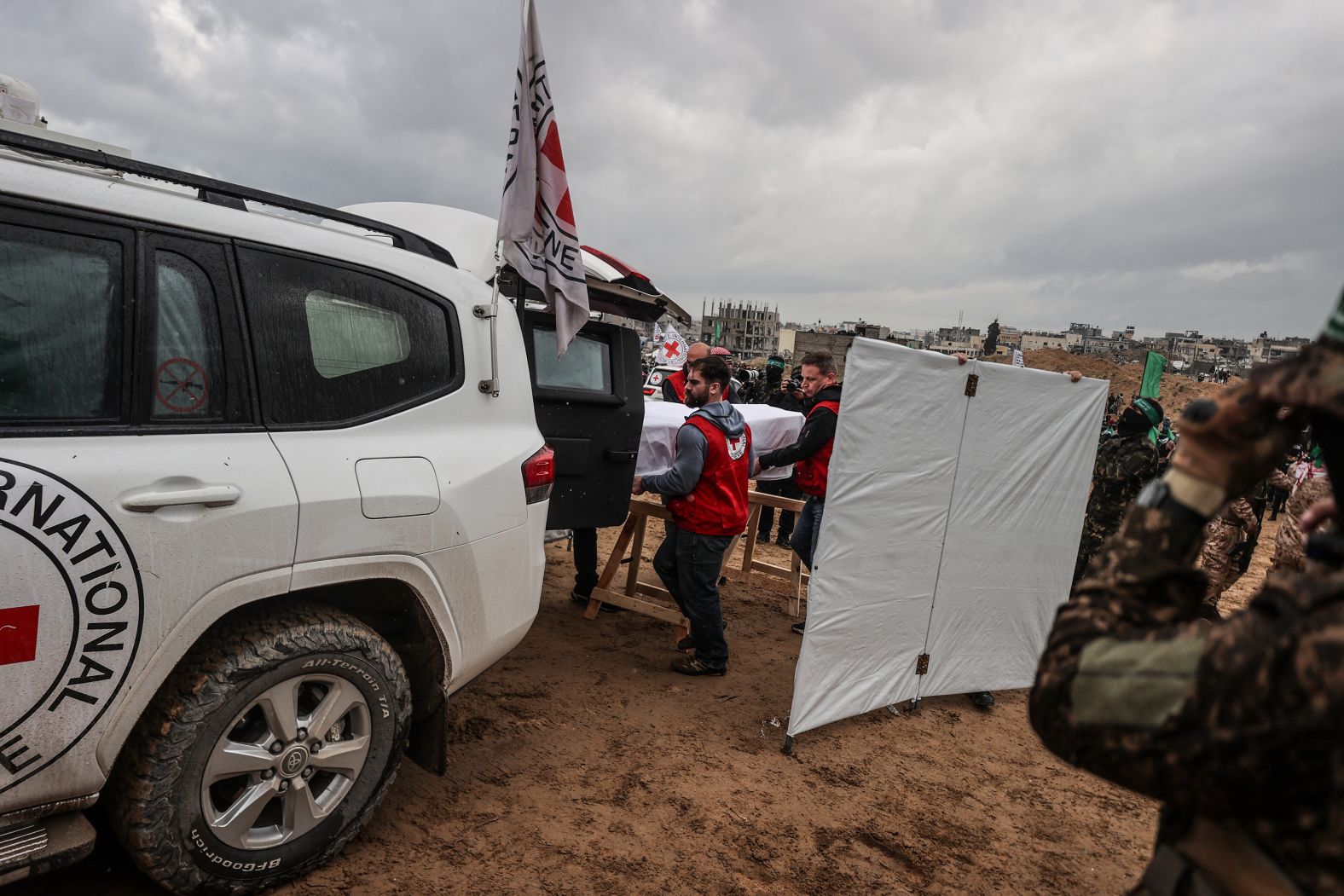 Members of the Red Cross receive the bodies of four Israeli hostages in Khan Younis, Gaza, on Thursday, February 20. Hamas put on a <a href="https://www.cnn.com/2025/02/20/middleeast/hamas-israel-hostages-release-bibas-intl-hnk/index.html">macabre handover ceremony</a> to return the bodies. It was the first time the militant group has released the remains of dead hostages since its attack on Israel in October 2023, and it marked a somber turn for a country more used to elation when former captives returned home alive.