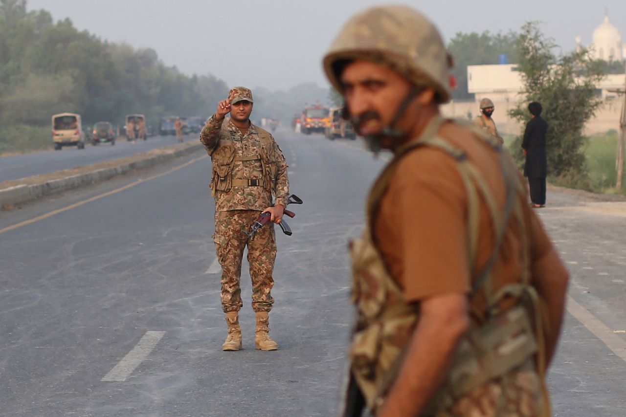 Soldiers cordon off a road in Ahmedpur East, Pakistan, after Indian missile strikes.