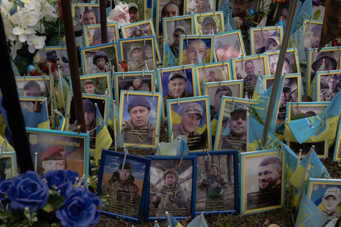 Ukrainian flags and portraits of soldiers are seen at a memorial for the fallen Ukrainian and foreign fighters on the Independence Square in Kyiv on May 14.