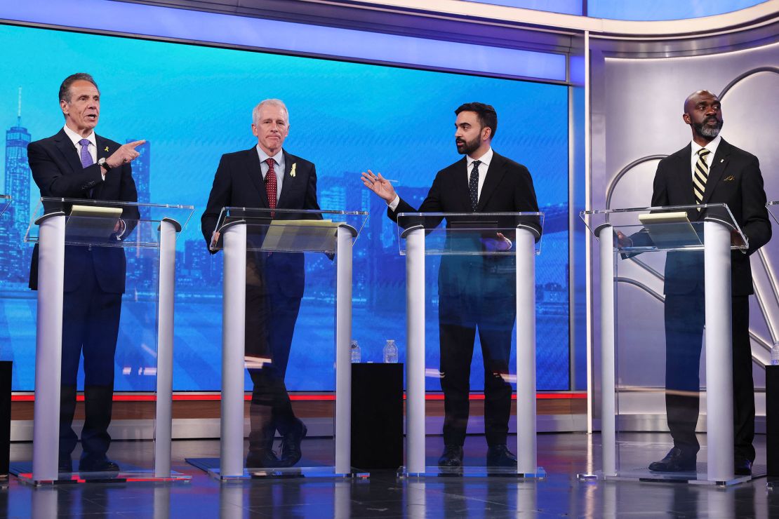 Democratic mayoral candidates Andrew Cuomo, left, and Mamdani, second from right, present arguments as Whitney Tilson, second from left, and Michael Blake, right, look on during a Democratic mayoral primary debate in New York on June 4.