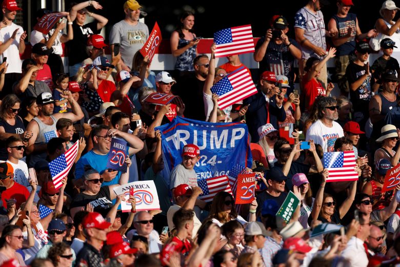People attend a rally with President Donald Trump at the Iowa State Fairgrounds in July.