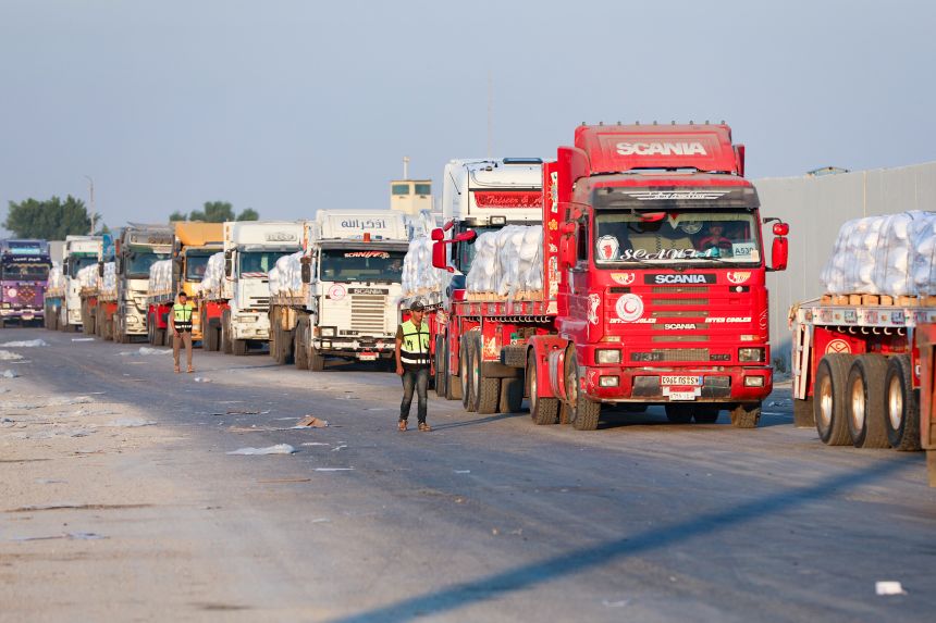 A convoy of aid trucks on the Egyptian side of the Rafah crossing with the Gaza Strip awaits permission to drive toward the besieged Palestinian territory on Sunday.