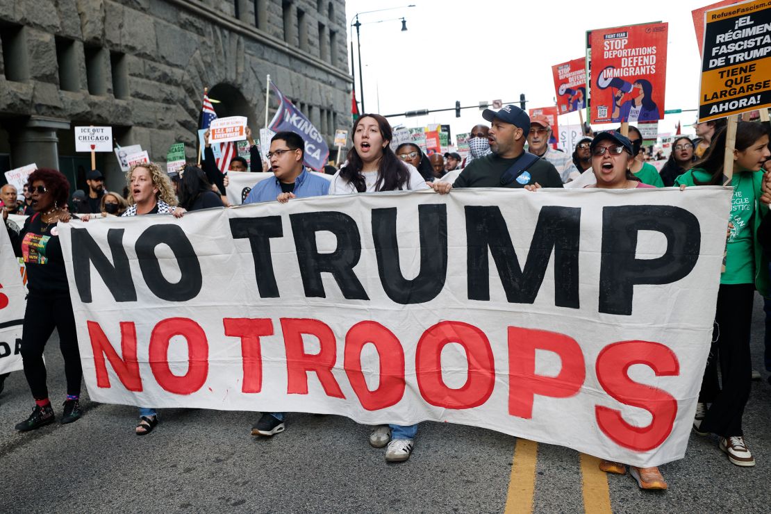 People protest the planned deployment of National Guard troops in Chicago on September 6, 2025.