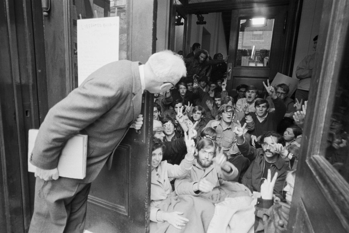 A professor finds an entrance blocked by a student sit-in, at one of four buildings taken over by demonstrations on Columbia University in April 1968.