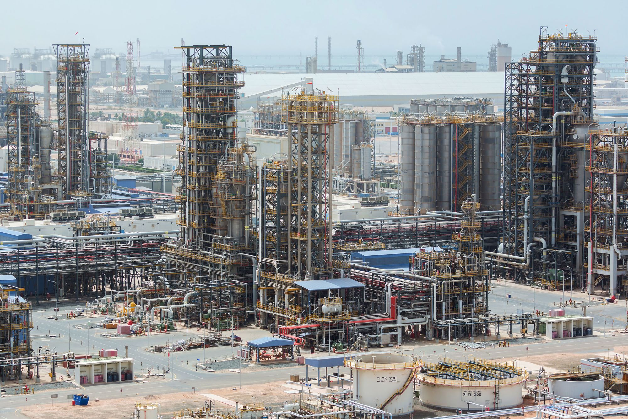 Cracking towers stand at the Ruwais refinery and petrochemical complex, operated by Abu Dhabi National Oil Co. (ADNOC), in Al Ruwais, United Arab Emirates.