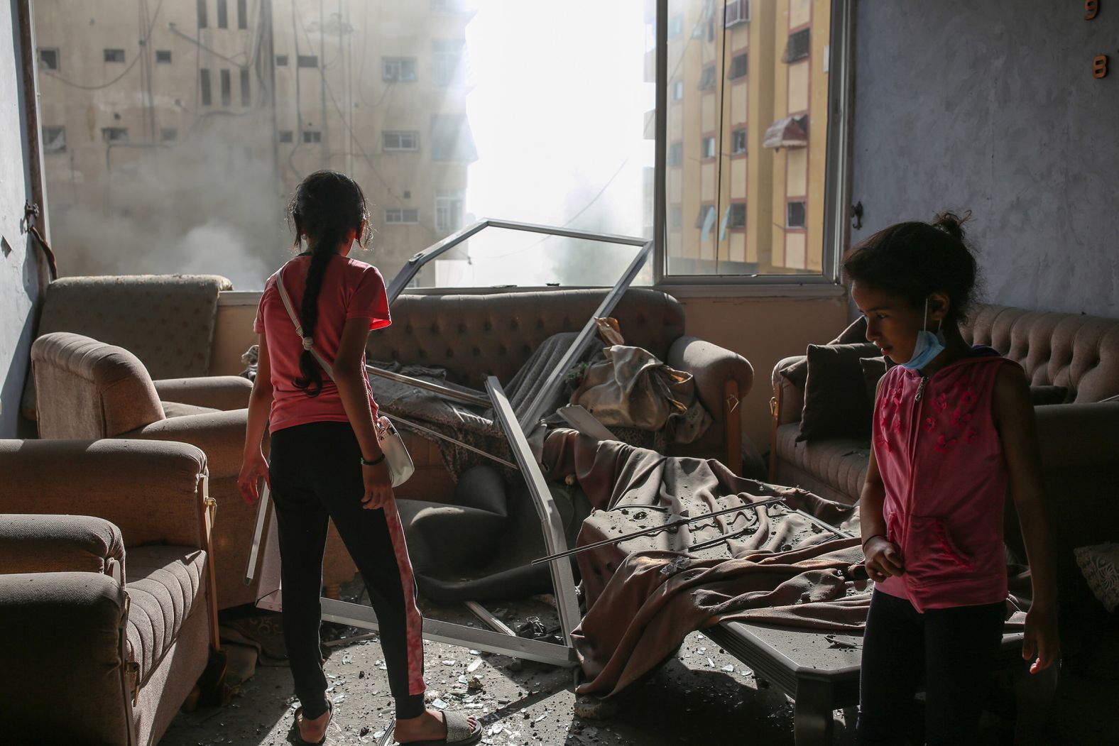 Palestinian children are seen in a damaged house in Gaza City after Israeli airstrikes on October 7.