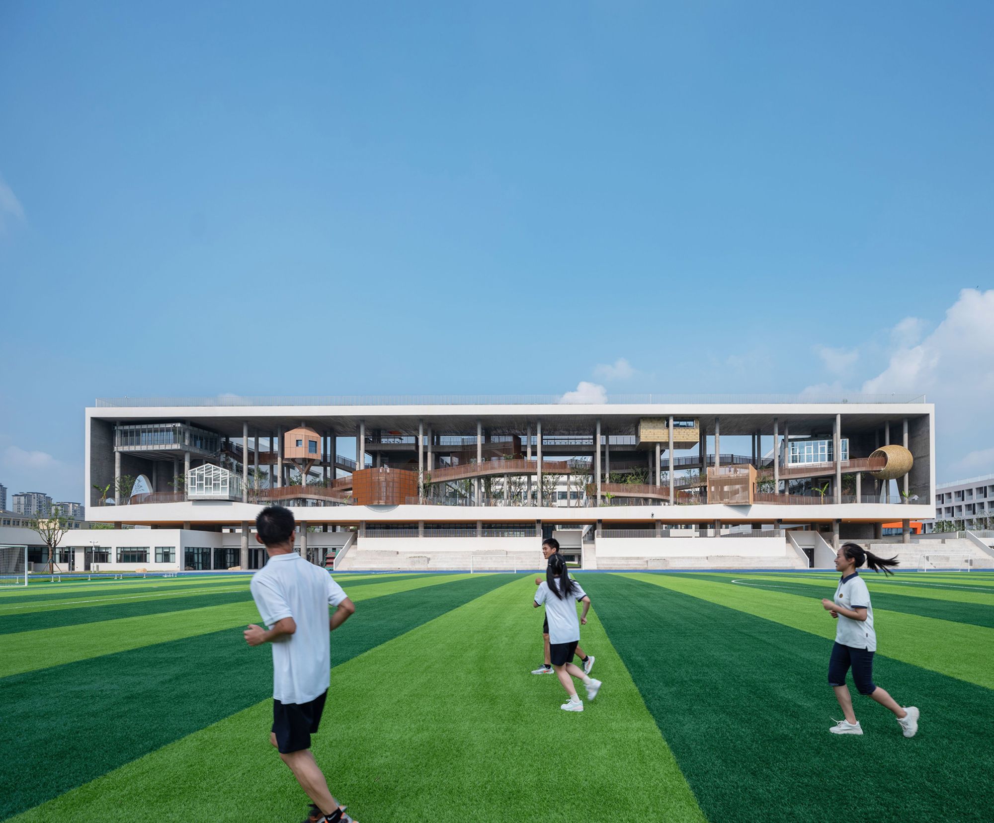 Huizhen High School is "a bold exploration of ‘efficiency-first’ campus design," the World Architecture Festival said.
