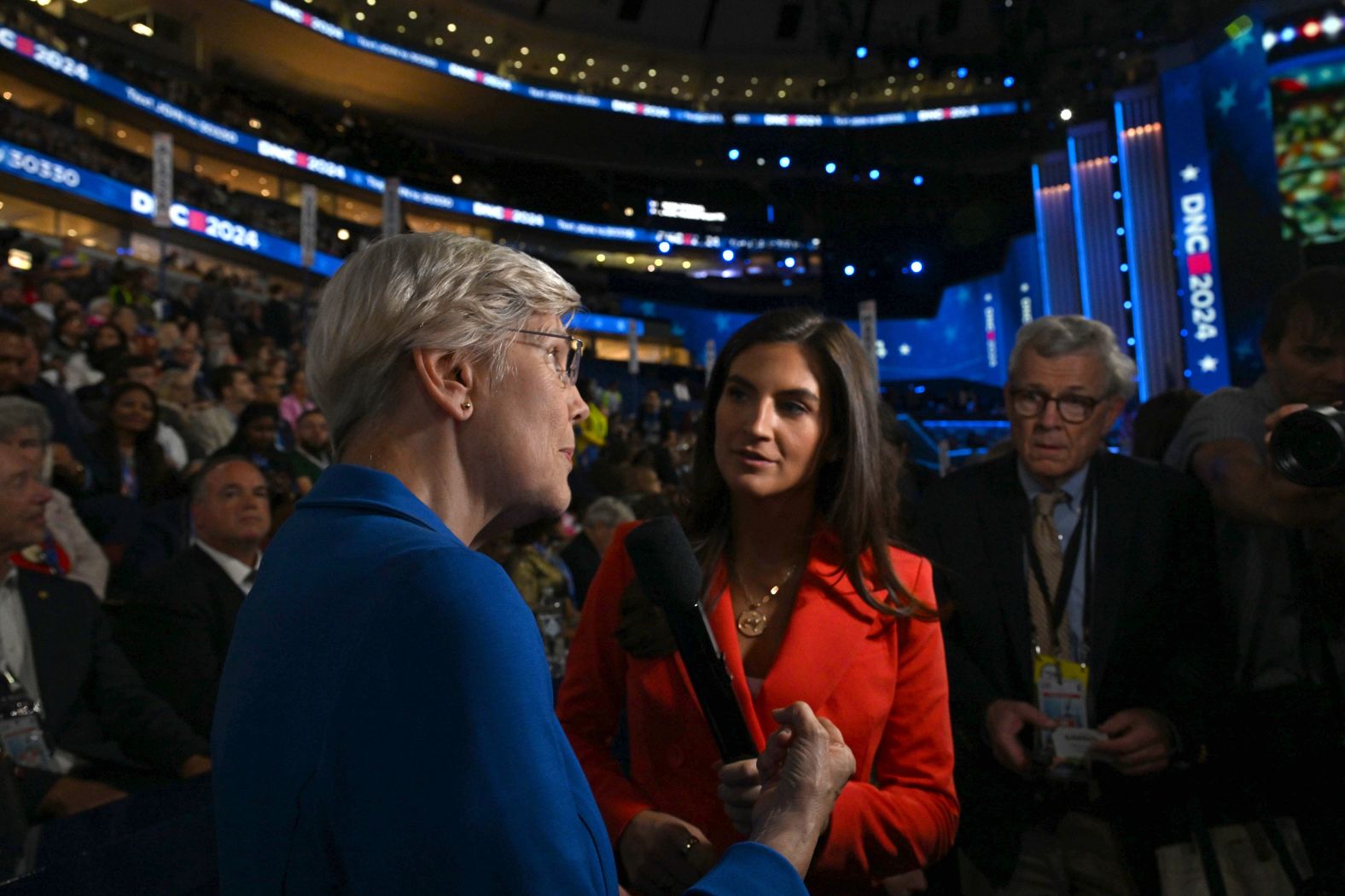 US Sen. Elizabeth Warren, left, talks to CNN's Kaitlan Collins on the convention floor on Wednesday.