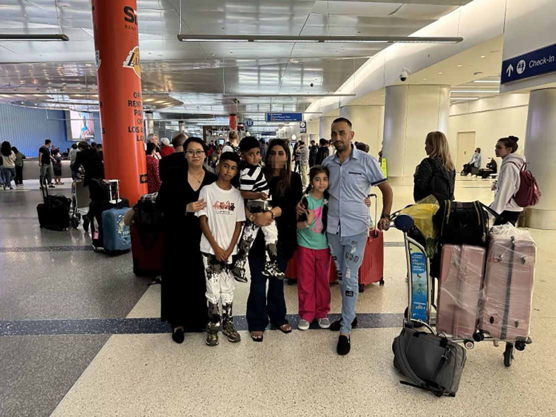 The Roman family together at LAX with their attorney, Christine Yoon. Portions of this image were obscurred by CNN to preserve the subjects privacy.