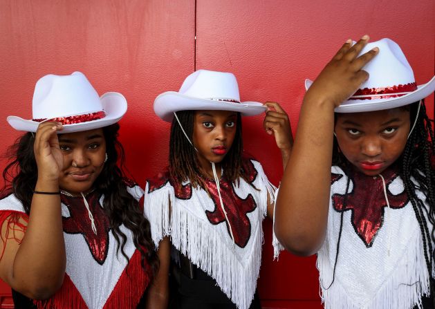 Sarai Howard Johnson, Zamirah Chadwick and Sydnee Littleton, from the Self Enhancement Inc. dance group, pose before performing at the 8 Seconds Juneteenth Rodeo in Portland, Oregon, on Sunday, June 16.