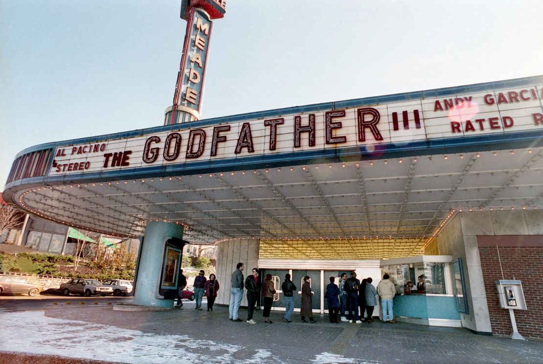 On Christmas day in 1990, people wait to purchase tickets at the Belle Meade Theater on for a screening of “The Godfather III,” starring Al Pacino and Andy Garcia.