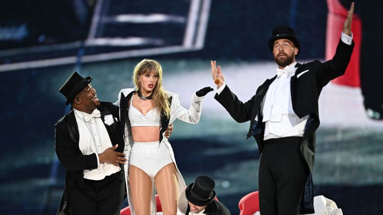 Taylor Swift is joined on stage by Travis Kelce (R), during “Taylor Swift | The Eras Tour” at Wembley Stadium on June 23, 2024 in London, England.