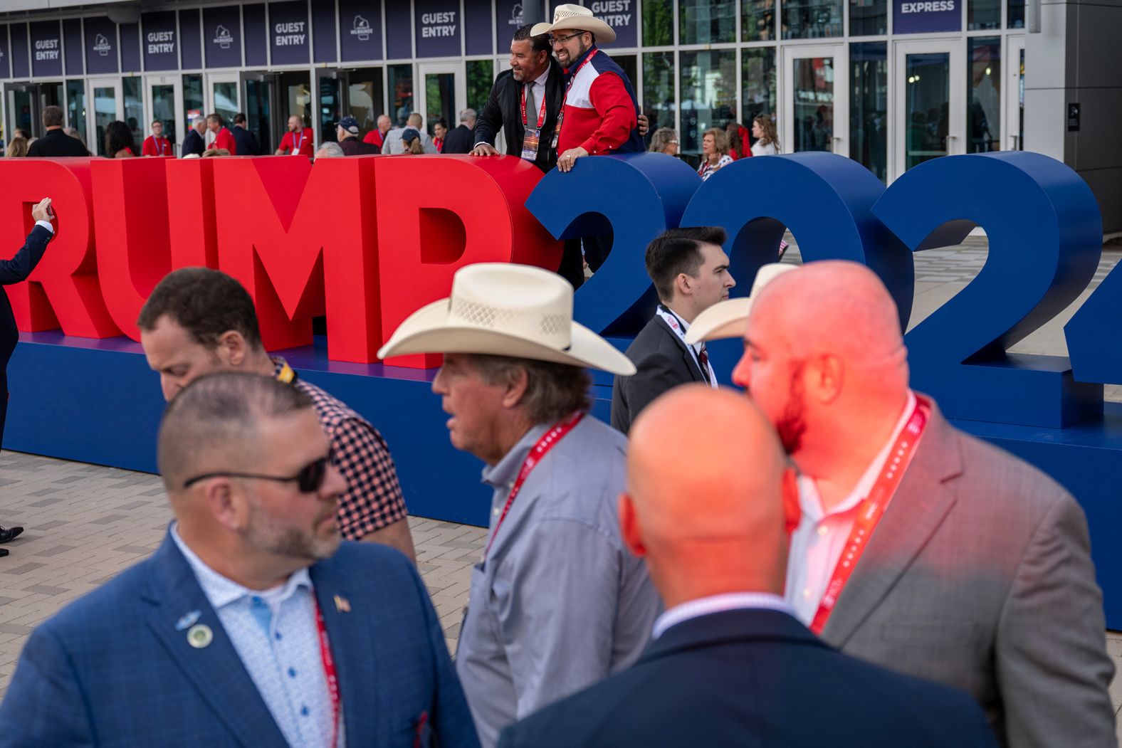 Convention attendees stand outside the Fiserv Forum on Wednesday.