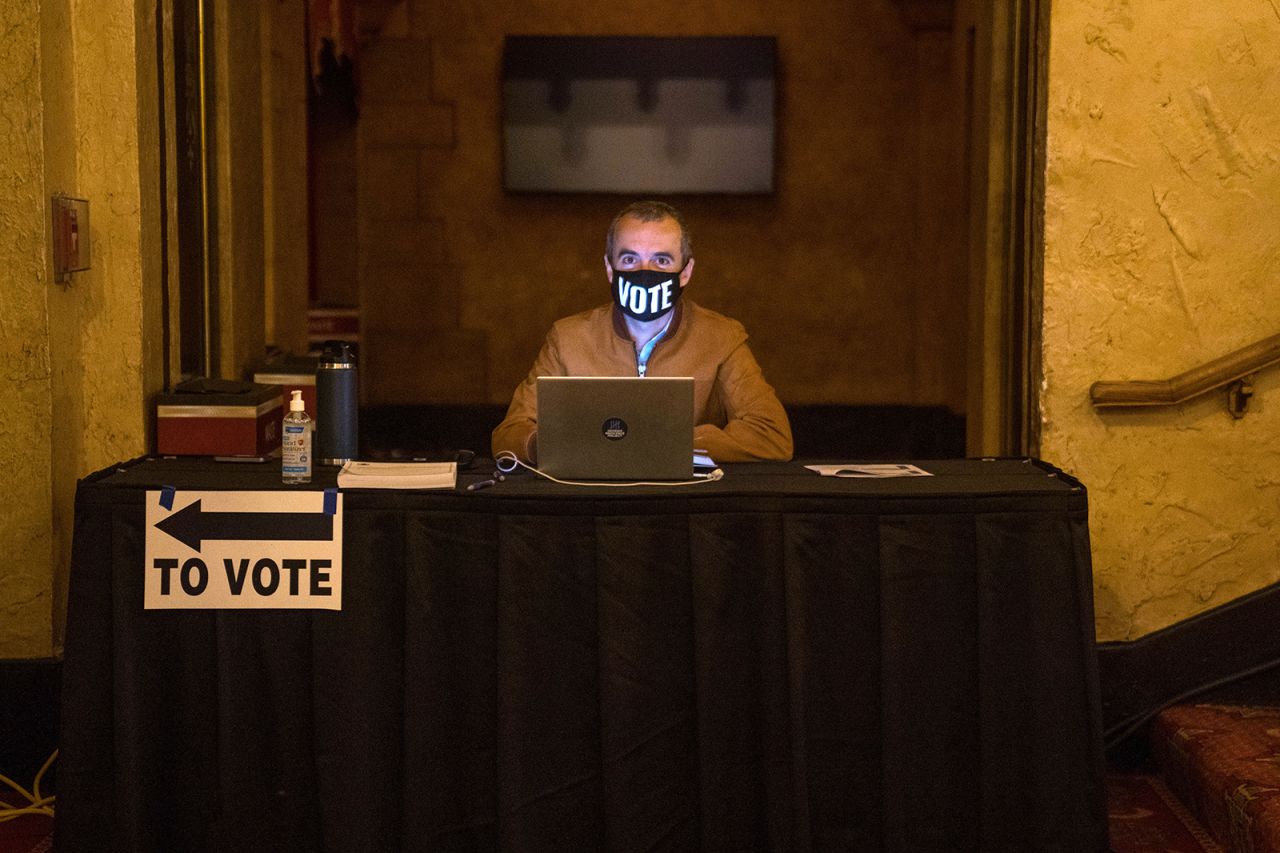 A poll worker waits for voters at the Fox Theater polling location on November 3, in Atlanta. 