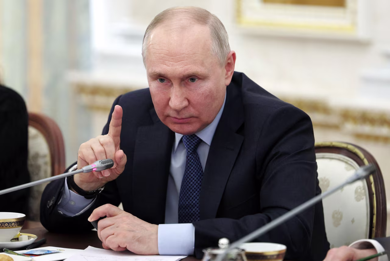 Russian President Vladimir Putin meets with war correspondents in Moscow on June 13.