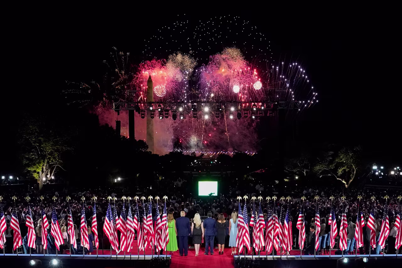 President Donald Trump, First Lady Melania Trump and other family members watch fireworks following the President's acceptance speech for the Republican Party nomination for reelection at the White House on Thursday in Washington.