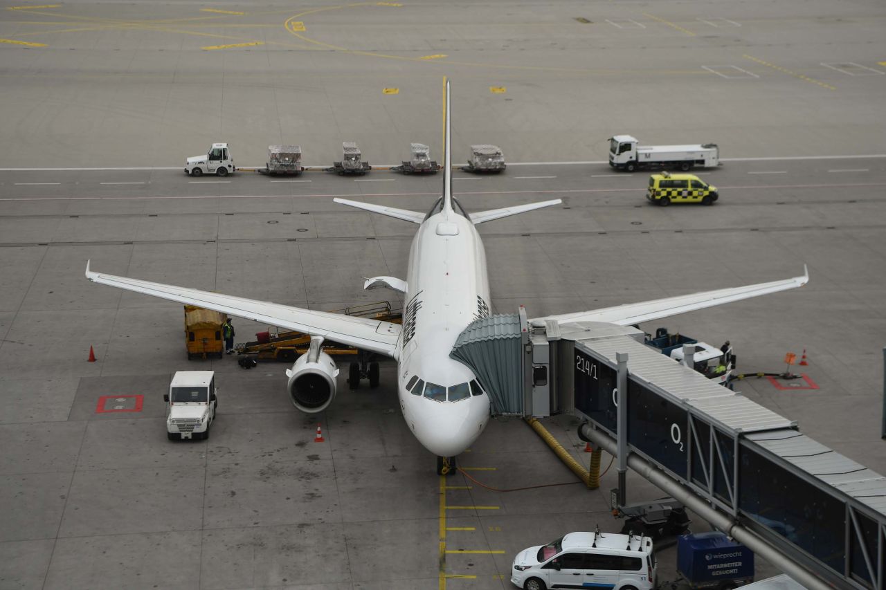 A Lufthansa plane is parked at a terminal at Munich International Airport in Freising, Germany on March 17.