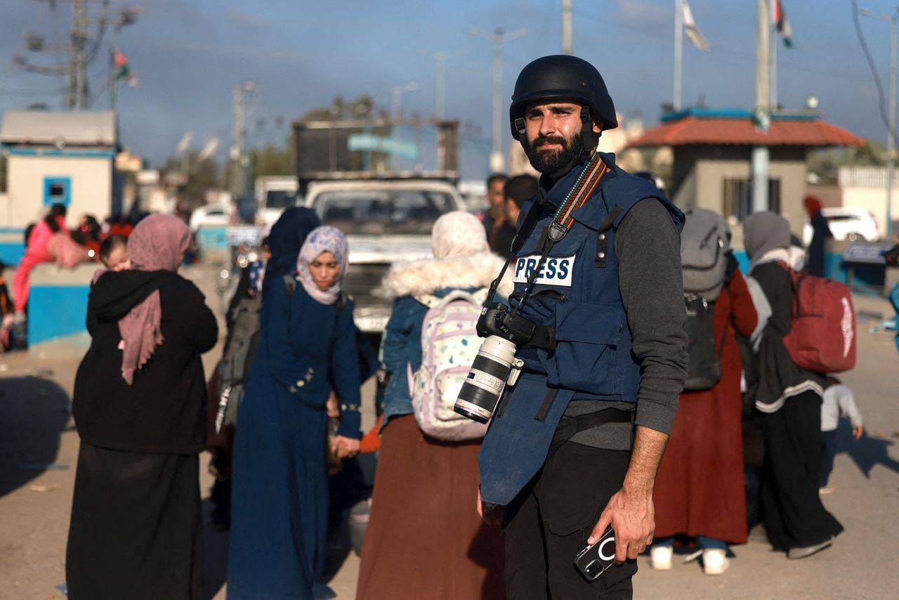 Palestinian photojournalist Motaz Azaiza stands in a street in the central part of the Palestinian territory on December 18.