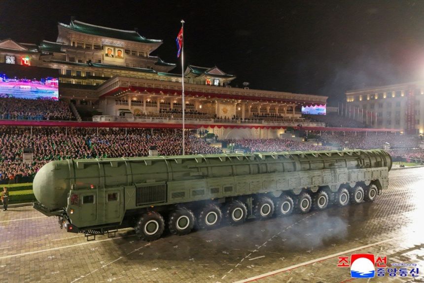 A transporter launcher North Korean state media said is the new Hwasong-20 intercontinental ballistic missile is shown during an overnight military parade in Pyongyang.