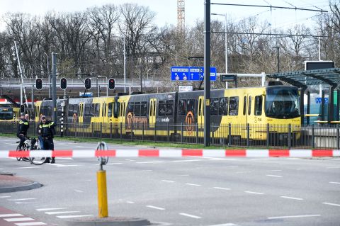 Policemen work on Monday in Utrecht, near a tram where a gunman opened fire.