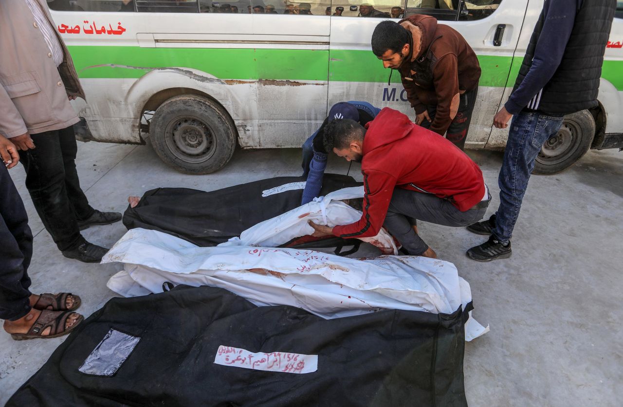 Relatives mourn over the bodies of family members killed in an Israeli airstrike, at Al Merouani Field Hospital in Rafah, on May 7.