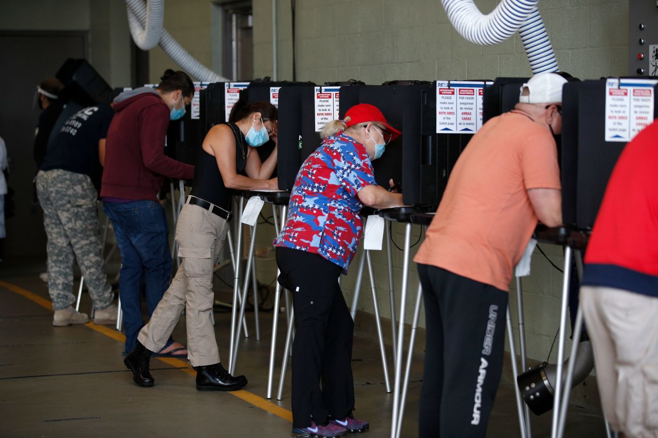 Voters fill out their ballots at a polling place in Miami Beach, Florida, on November 3.