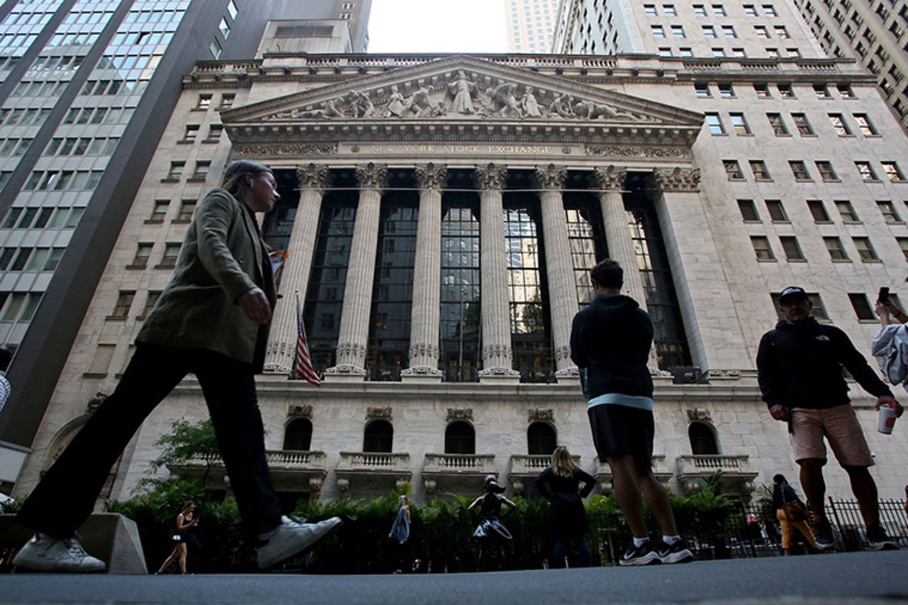 People make their way near the Stock Exchange in New York City on June 14. 