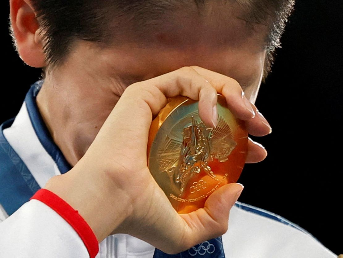 Taiwan's Lin Yu-ting reacts after receiving the gold medal for her victory in the women's featherweight boxing final on August 10, 2024, in Paris.