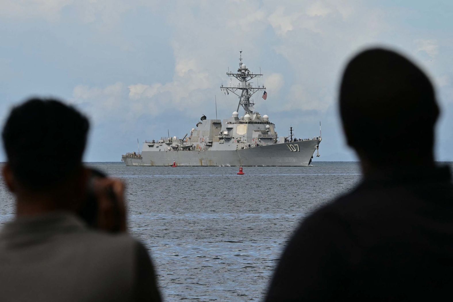Photographers take pictures as the USS Gravely enters Port of Spain, the capital of Trinidad and Tobago, on Sunday, October 26. The US warship docked there as the Trump administration <a href="index.php?page=&url=https%3A%2F%2Fwww.cnn.com%2F2025%2F10%2F26%2Fworld%2Fus-warship-docks-trinidad-venezeula-latam-intl">boosts military pressure</a> on neighboring Venezuela and its president, Nicolás Maduro.
