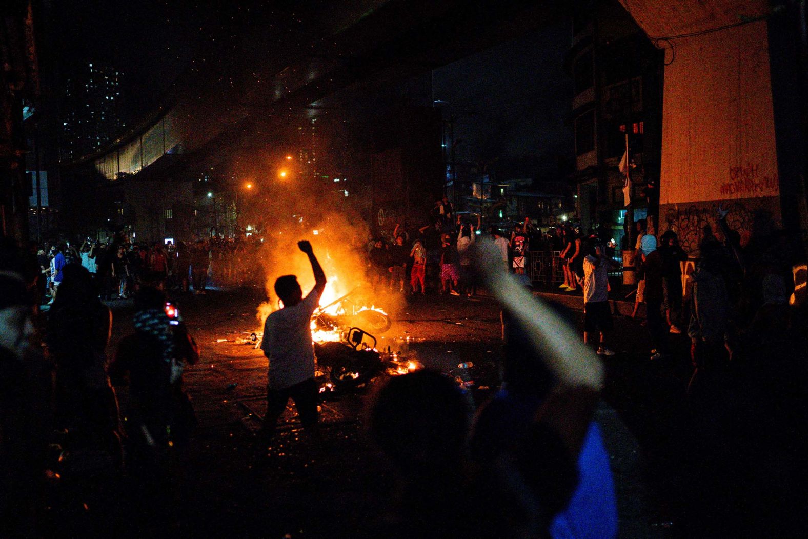 A motorcycle burns in Manila, Philippines, during an anti-corruption protest on Sunday, September 21. <a href="index.php?page=&url=https%3A%2F%2Fwww.cnn.com%2Fphilippines-anti-corruption-protest-digvid">Protests erupted in Manila</a> over the government’s alleged mismanaging of flood projects.